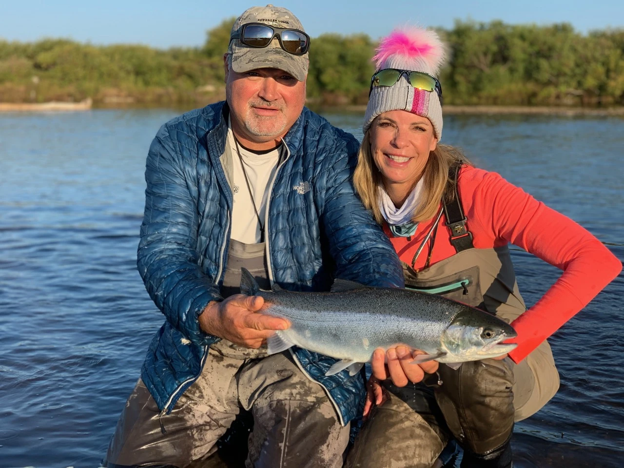Lodge guests displaying a massive salmon catch