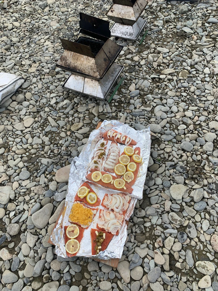 Shore lunch salmon prep on the river